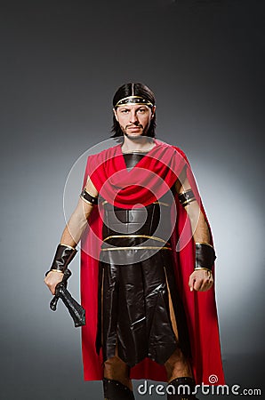 The roman warrior with sword against background Stock Photo