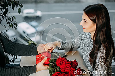 Romance background, couple in love on date, man giving roses and Stock Photo