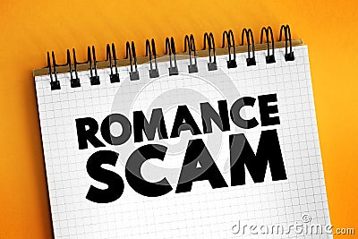 Romance scams - when a criminal adopts a fake online identity to gain a victim`s affection and trust, text concept on notepad Stock Photo