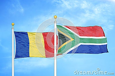 Romania and South Africa two flags on flagpoles and blue sky Stock Photo