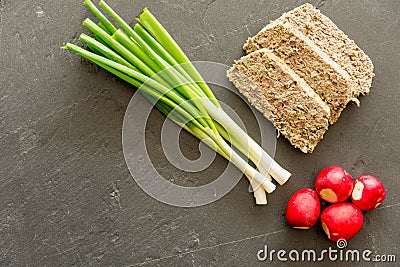 Romanian easter food dish lamb tripe stuffed with mincen lamb organs and fresh green onion and radishes with copy space Stock Photo