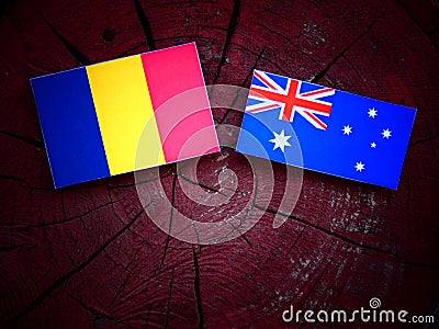 Romanian flag with Australian flag on a tree stump isolated Stock Photo