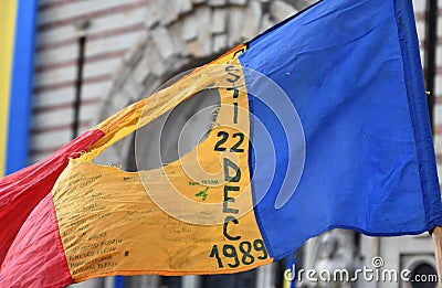 Romanian flag with the communist coat of arms cut out Editorial Stock Photo