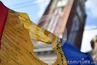 Romanian flag with the communist coat of arms cut out Editorial Stock Photo