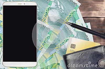 1 Romanian leu bills and smartphone with purse and credit card. E-payments or e-commerce concept. Online shopping and business Stock Photo