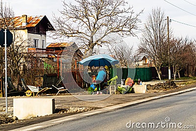 Romanian peasants selling vegetables and fruits on the road in Targoviste, Romania, 2021 Editorial Stock Photo