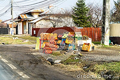 Romanian peasants selling vegetables and fruits on the road in Targoviste, Romania, 2021 Editorial Stock Photo