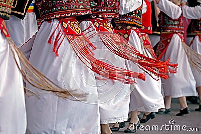 Romanian traditional dance with specific costumes Stock Photo