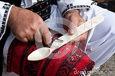Romanian traditional wooden spoon making Stock Photo