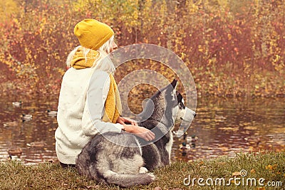 Romantic autumn portrait of a woman and her dog Stock Photo