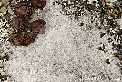 Romantic background in soft autumn colors with dried roses and pot pourri on white rice paper Stock Photo