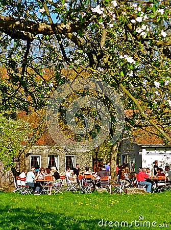 Romantic Bavarian Beer Garden in Spring Editorial Stock Photo