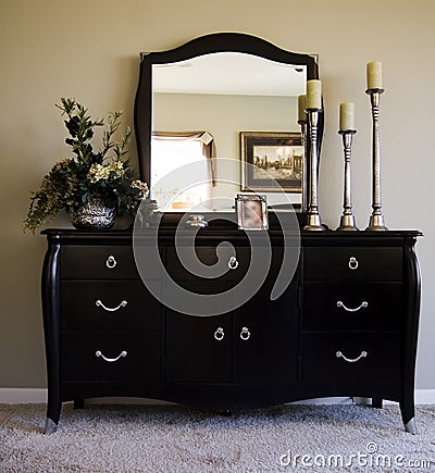 romantic bedroom with mirror on dresser Stock Photo