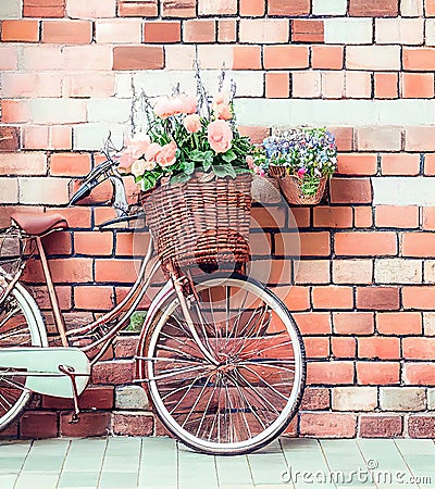 Romantic Bike with Colorful Wild Flower Basket Leaning on the Wall- Generated Artificial Intelligence -AI Stock Photo