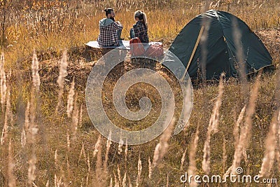 Romantic camping couple tent meadow fall nature Stock Photo
