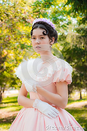 Romantic, charming woman fanning herself fan and with an attentiv Stock Photo