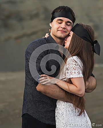 Romantic couple blindfolded with black ribbon. Love blind concept Stock Photo