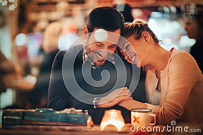 Romantic couple dating in pub Stock Photo