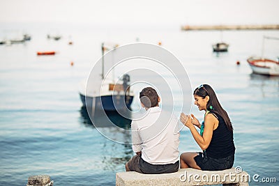 Romantic couple having relationship problems.Woman crying and begging a man.Fisherman life,dangerous occupation.Navy sailors Stock Photo