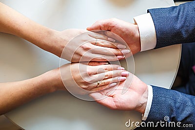 Romantic couple holding hands. Lovers or newlywed married young couple in romance. wedding theme. top view Stock Photo