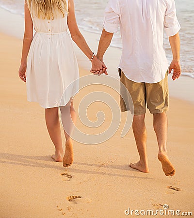 https://thumbs.dreamstime.com/x/romantic-couple-holding-hands-walking-beach-sunset-man-women-love-footprints-sand-35119748.jpg