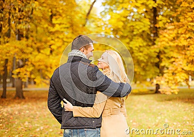 Romantic couple kissing in the autumn park Stock Photo