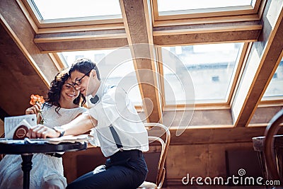 Romantic couple in love bonding in cafe Stock Photo