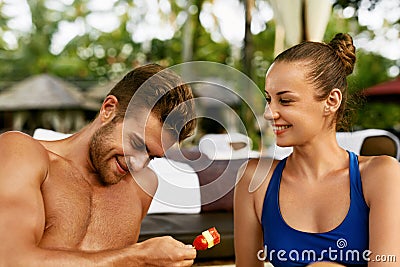Romantic Couple In Love Having Fun Together Feeding Each Other Stock Photo