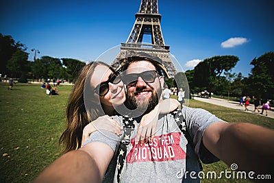 Romantic couple making selfie in front of Eiffel Stock Photo