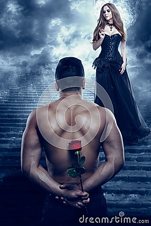 Romantic Couple, Man give Flower to Beautiful Woman, Sexy Lover Athletic Holding Rose Stock Photo