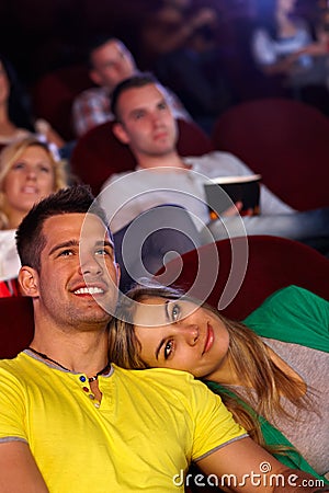 romantic couple movie theater young sitting cinema watching smiling 36937203