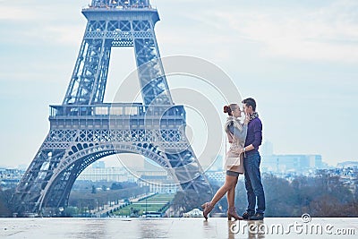 Romantic couple near the Eiffel tower in Paris, France Stock Photo