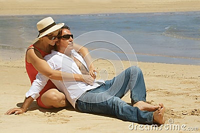 Romantic couple sitting on the Stock Photo