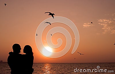 Romantic couple at sunset Stock Photo