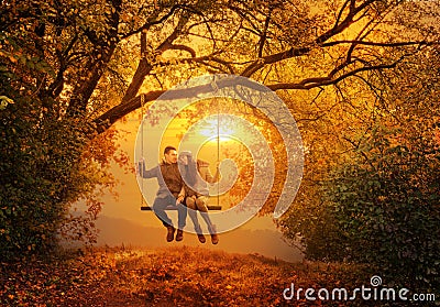 Romantic couple swing in the autumn park Stock Photo