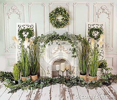 Romantic decorations with greenery and fireplace, romantic mood Stock Photo