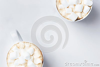 Romantic desk top with two cups of coffee with marshmallows on marble table. Top view. Stock Photo