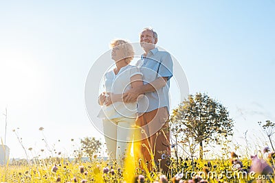 Romantic elderly couple enjoying health and nature in a sunny day of summer Stock Photo