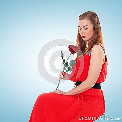 Romantic elegant woman in red dress with flower rose Stock Photo