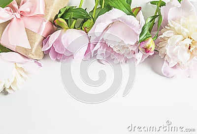 Romantic greeting card with pink peonies and handmade gift box on a white background Stock Photo