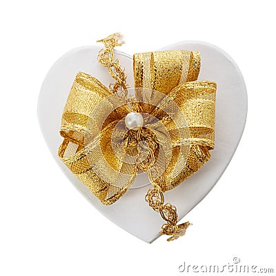 Romantic heart shaped gift and gold bow Stock Photo