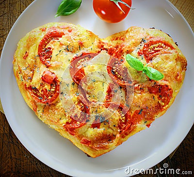 Romantic heart shaped Italian pizza Stock Photo