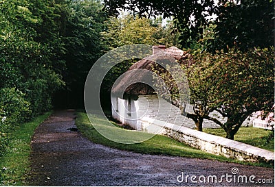 Romantic Irish Cottage in Summer with pathway Stock Photo