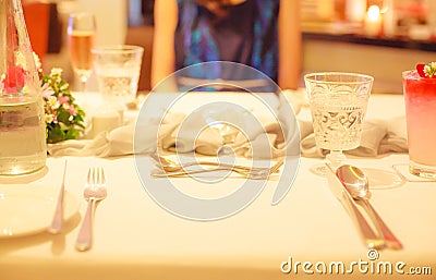 Romantic luxurious lunch or dinner table, dating with wife or girlfriend, anniversary surprise meal with blurred woman background. Stock Photo