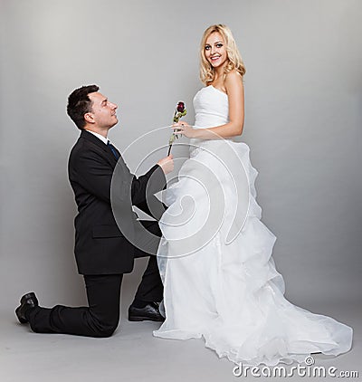 Romantic married couple bride and groom with rose Stock Photo