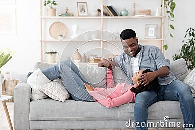 Romantic Moments. Black Couple In Love Bonding Together While Relaxing At Home Stock Photo