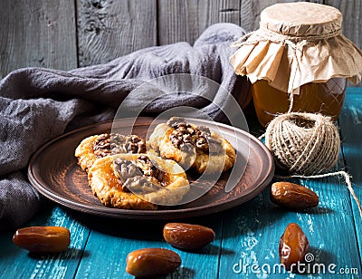 Romantic morning still life, in a rustic style with cookies, honey and dates Stock Photo