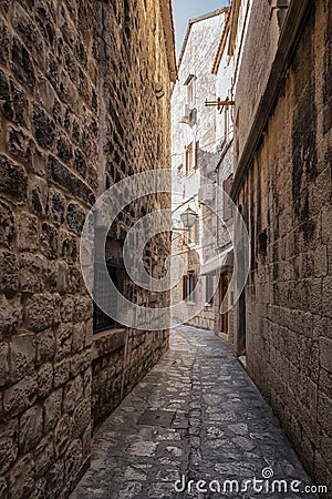 Romantic narrow street in the old town of Trogir Stock Photo