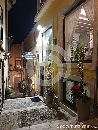 Romantic narrow street in the Taormina Editorial Stock Photo