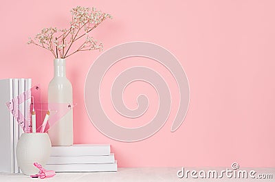 Romantic office workplace of white and pink stationery, bouquet dry flower on pastel pink background. Stock Photo